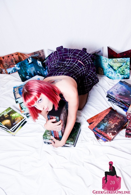 Alice Malice naked with her World of Darkness books and dice